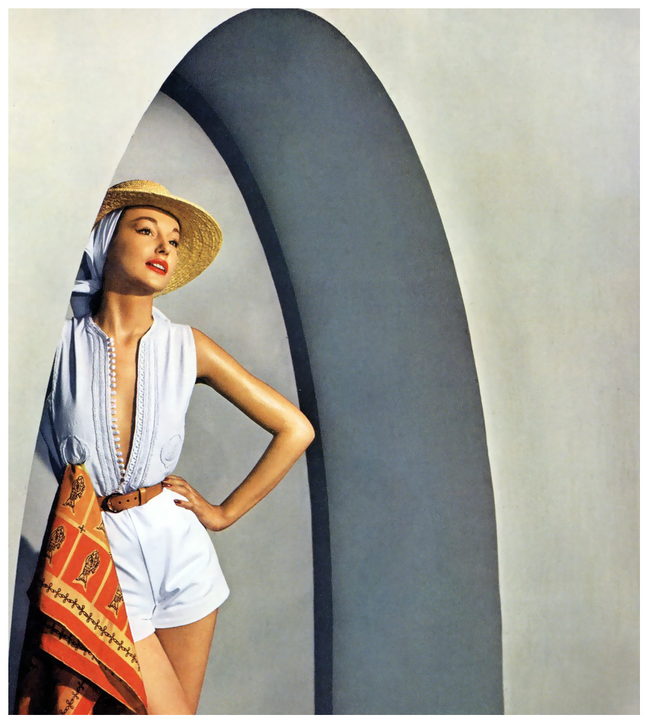 model-in-carolyn-schnurers-white-oxford-cloth-shorts-and-top-with-white-cord-passementerie-based-on-a-djellabah-photo-by-louise-dahl-wolfe-in-tunisia-for-cover-of-harpers-bazaar-june.jpg
