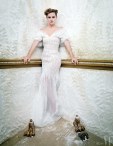 Emma Watson wears a gown by Oscar de la Renta
